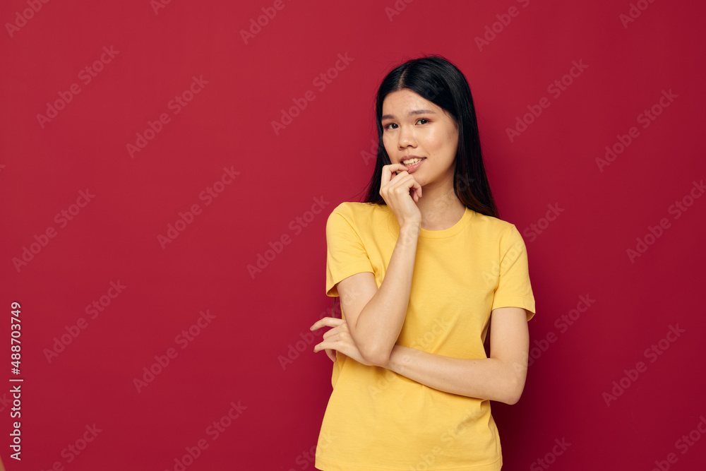 pretty brunette gestures with his hands in a yellow t-shirt casual wear Lifestyle unaltered pretty brunette gestures with his hands in a yellow t-shirt casual wear Lifestyle unaltered