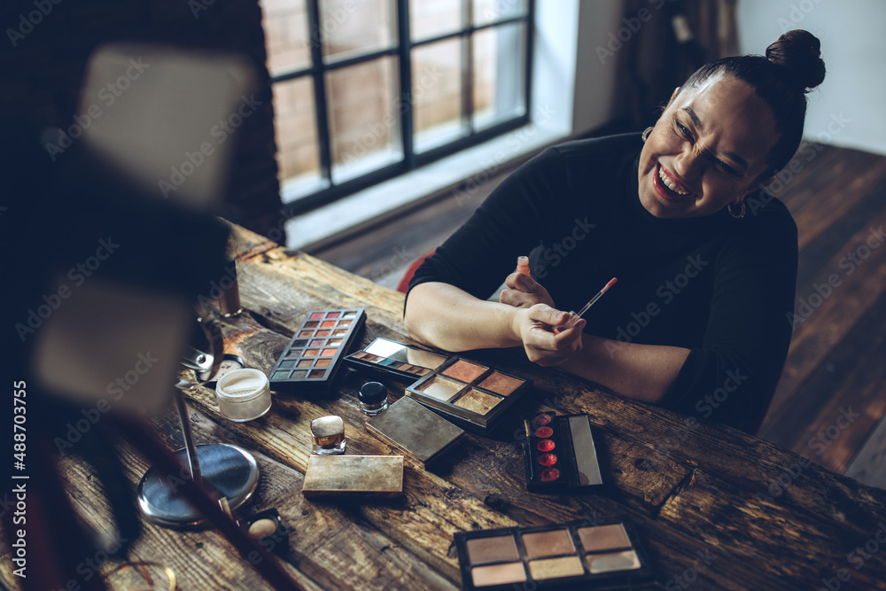Fototapeta premium A woman does makeup live. High quality photo