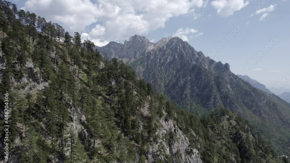 Frontal drone video advancing over the hills of the Valbona valley, Albania, fly very close to the ground appreciating the beauty of the pines and trees in the area. Frontal drone video advancing over the hills of the Valbona valley, Albania, fly very close to the ground appreciating the beauty of the pines and trees in the area.