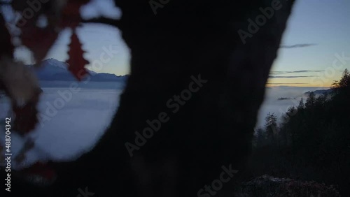 Bled Slovenia captured at sunrise with in the nature with beautiful mountains and landscapes cover in fog and nice golden hour colors filmed in  dynamic movement with a camera on a gimble photo