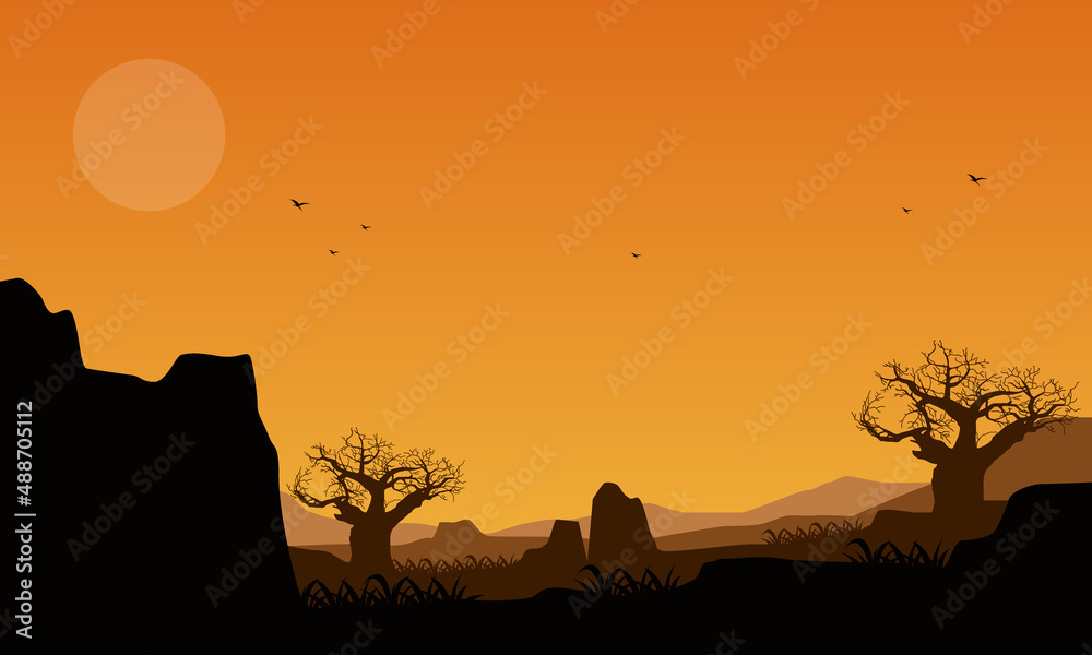 Beautiful mountain scenery with silhouettes of pine trees and ravines from the village at dusk