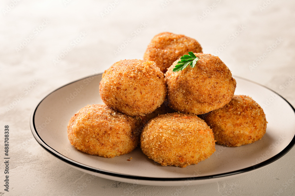 Plate of balls POTATO CROQUETTES close-up Plate of balls POTATO CROQUETTES close-up