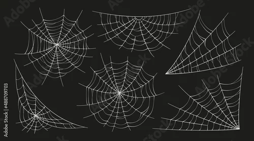 Naklejka na ścianę Scary spider webs. White cobweb silhouette isolated on black background. Set of doodle spidewebs. Hand drawn cob webs for Halloween party. Vector illustration.