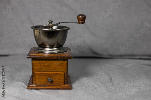 manual coffee grinder on a gray background