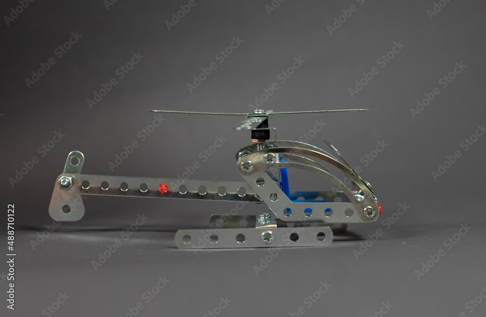 helicopter with metal construct on a gray background helicopter with metal construct on a gray background