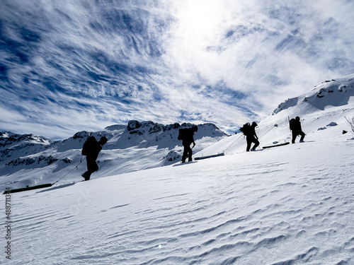 Mountaineers walking in peak mountains in winter season