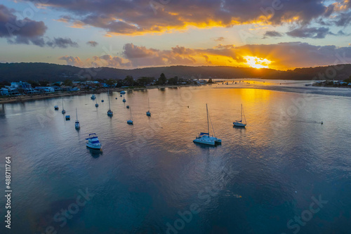 Aerial sunrise waterscape with boats © Merrillie