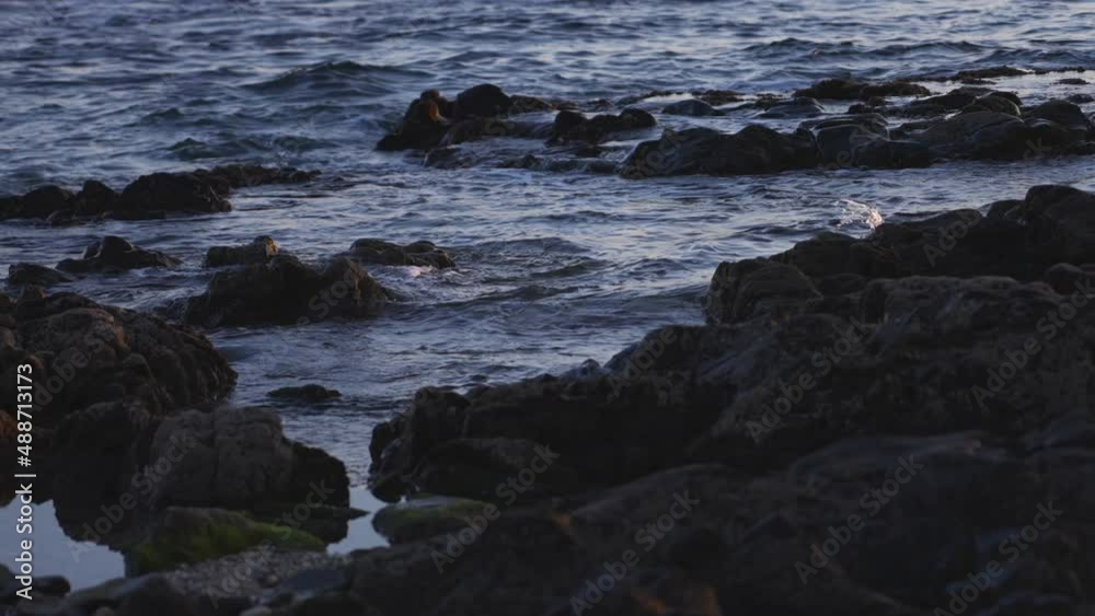 Waves at the rocks in slow motion Waves at the rocks in slow motion