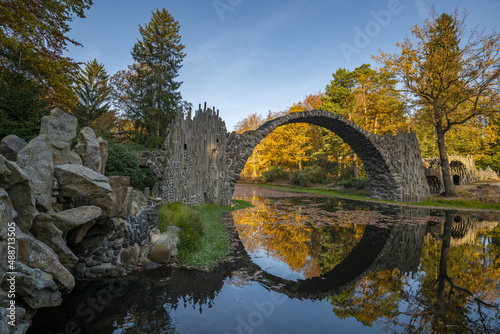 Bridge in rhododendron park in Kromlau in a beautiful autumn mood