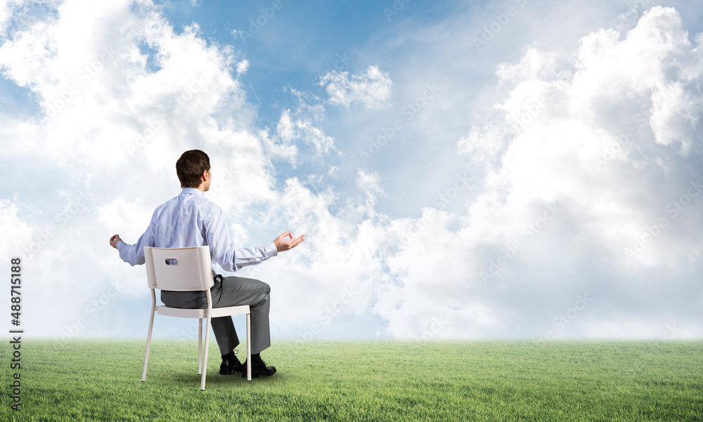 businessman meditates on office chair businessman meditates on office chair