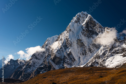Fototapeta Naklejka Na Ścianę i Meble -  Cholatse mountain peak view from Dzongla village, Himalaya mountains range in Everest base camp trekking route, Nepal