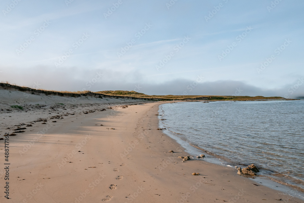 Beautiful empty white sandy beach in a morning in a nature reserve on the island of Islay in Scotland