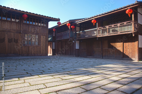 Traditional Chinese wooden Houses with lanterns hanging on a square, Fuzhou,Fujian,China