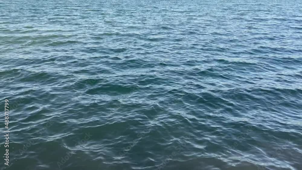 shallow waves on top of blue water. Pure blue water. small waves from the wind on the water shallow waves on top of blue water. Pure blue water. small waves from the wind on the water