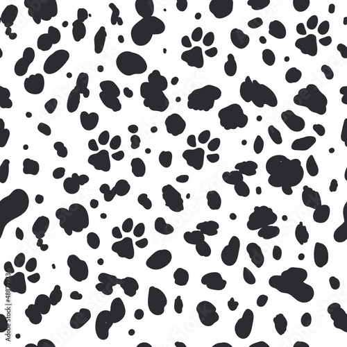 Dalmatian seamless pattern. Animal skin print. Dogs black dots and paw on white background. Vector