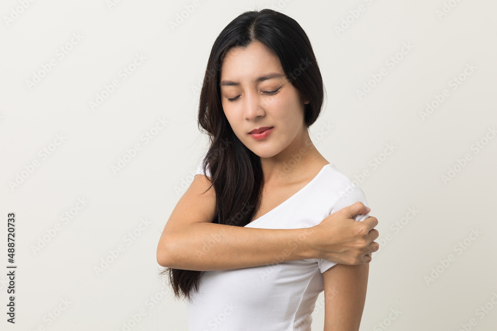Asian woman has problem with structural posture She had neck and shoulder pain. She massaged her neck and shoulders for relief. reduce muscle tension. Standing on isolated white background Asian woman has problem with structural posture She had neck and shoulder pain. She massaged her neck and shoulders for relief. reduce muscle tension. Standing on isolated white background