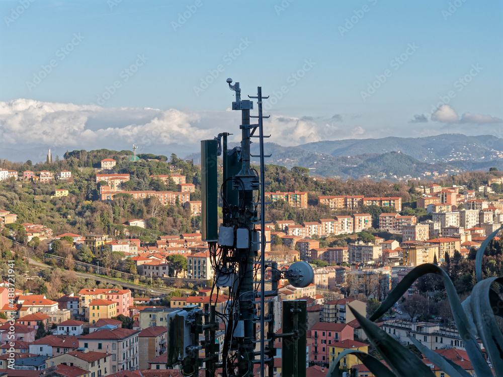 Fototapeta premium Antenna witn 5G technology in rural countryside at sunset. Telecom tower witn 5G and 4G network, telecomunication base station