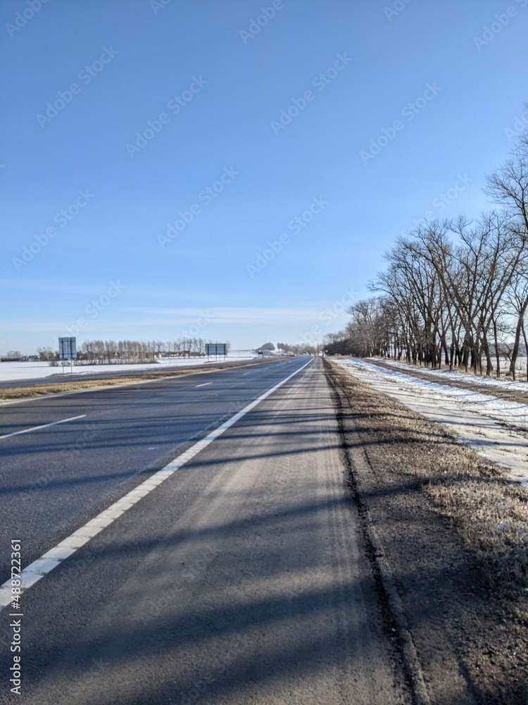 good road outside the city in winter