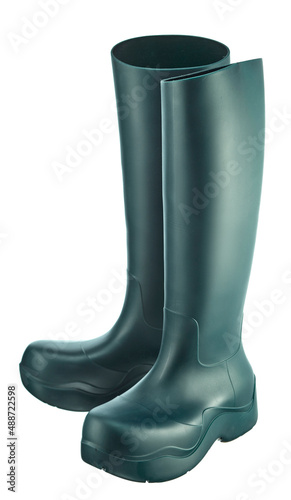 Rubber rain boots of dark green color, with a high top, isolated on a white background.