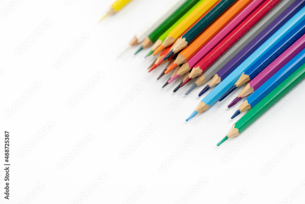 blunt colour pencils are arranged in the line on the white background and ready to paint. blunt colour pencils are arranged in the line on the white background and ready to paint.