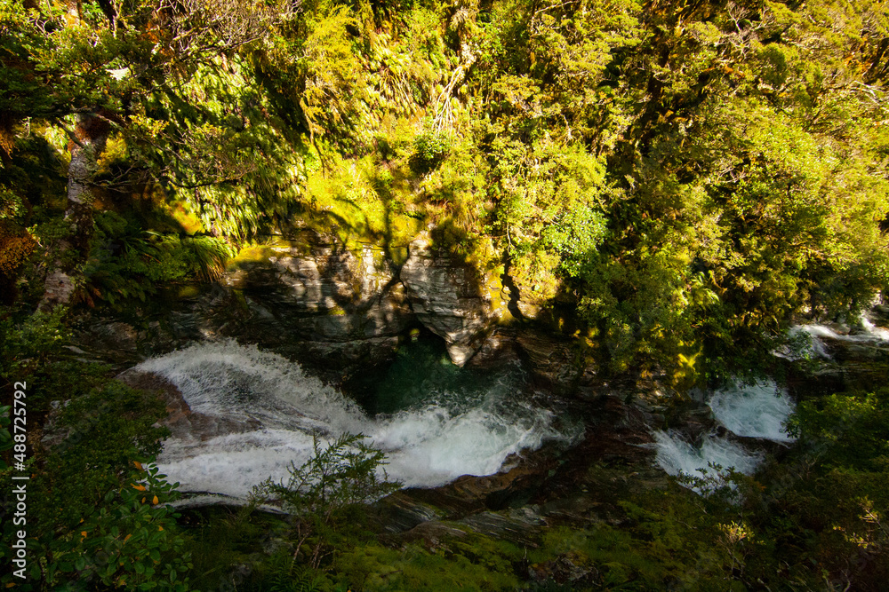 High angle view of Anderson Cascades falls, cascade waterfall on Milford Track Great walk, Fiordland, New Zealand High angle view of Anderson Cascades falls, cascade waterfall on Milford Track Great walk, Fiordland, New Zealand