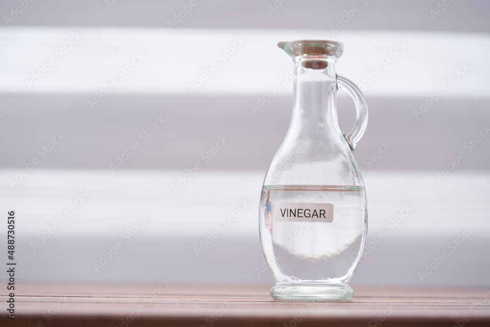 white vinegar on wood table top Stock Photo Adobe Stock