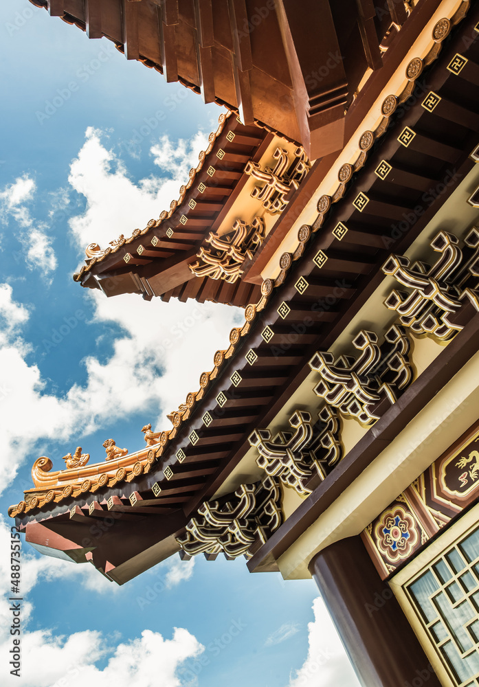 Gable roof architecture against a blue sky background of Taiwanese temple-style at Fo Guang San Temple. Selective focus. Gable roof architecture against a blue sky background of Taiwanese temple-style at Fo Guang San Temple. Selective focus.