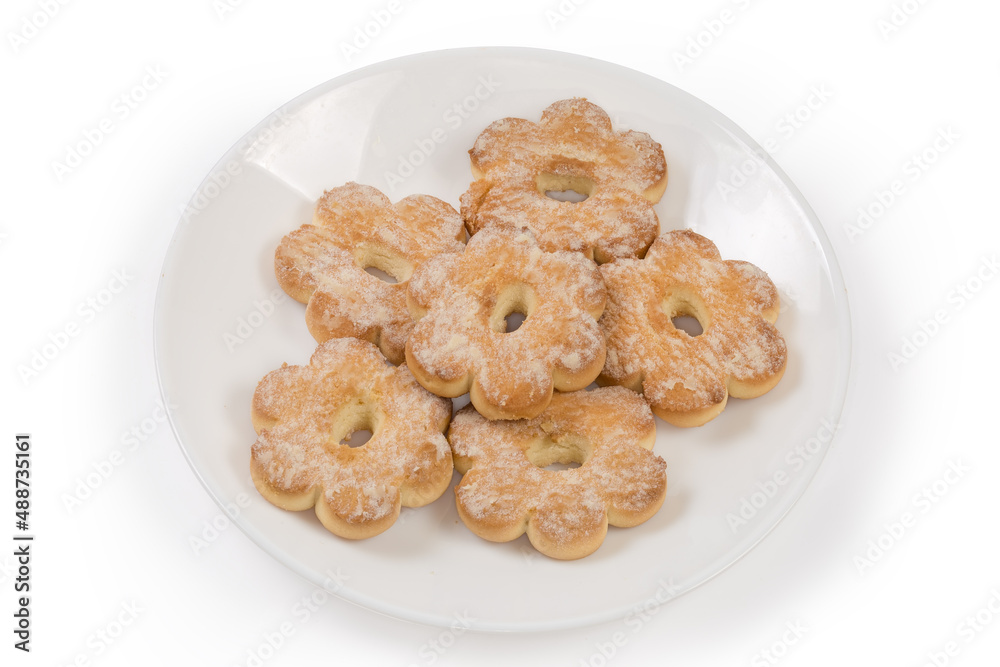Shortbread cookies in shape of flower sprinkled with powdered sugar Shortbread cookies in shape of flower sprinkled with powdered sugar