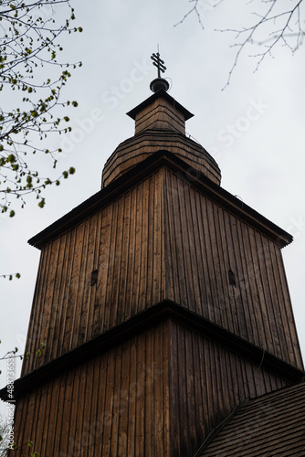 The Greek Catholic wooden church of Saints Cosmos and Damian in a village Vysny Komarnik, Slovakia photo