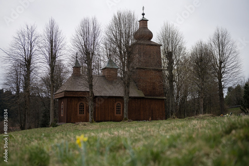 The Greek Catholic wooden church of Saints Cosmos and Damian in a village Vysny Komarnik, Slovakia photo