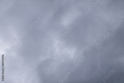 low angle view on dark cloudy sky, stormy weather