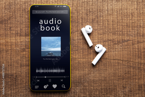 Streaming service. Listen audiobook online concept, online music player app on smartphone photo