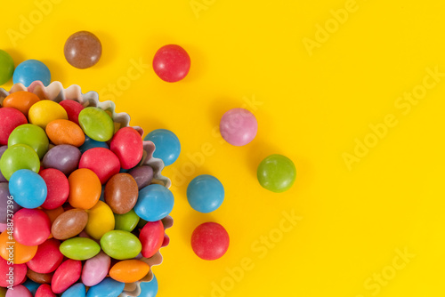 color candys on yellow background