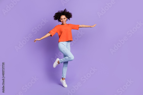 Full size photo of lovely good mood carefree lady traveling on summer vacation isolated on violet color background