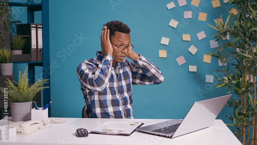Photography Amazed worker doing three wise monkeys symbol at desk, using laptop computer to plan growth