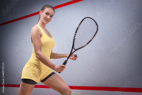 Image of a woman playing squash. Sports concept.