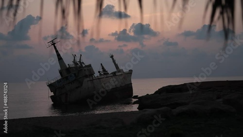 a ship that ran aground at sunset