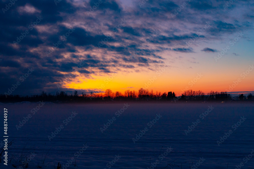 Winter sunset in the field . Winter landscape. Winter sunset in the field . Winter landscape.
