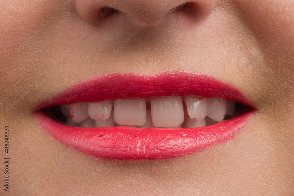 toothy smile of human red lips closeup toothy smile of human red lips closeup