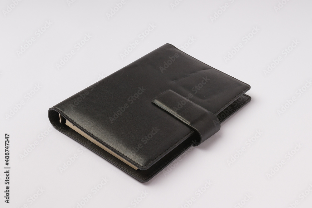black leather diary on white background black leather diary on white background