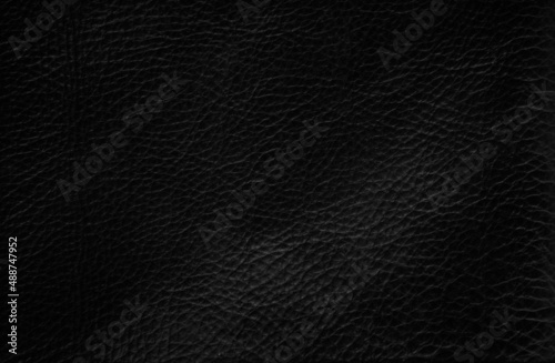 Closeup of seamless black leather texture background, surface material for fashion dark pattern luxury 