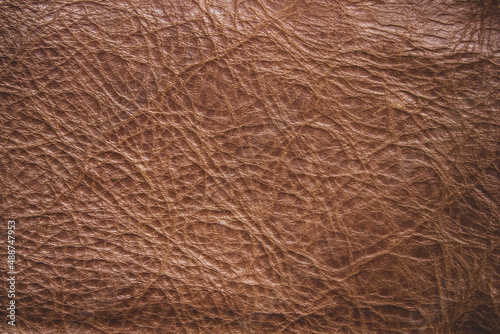 Genuine leather texture background. Dark brown, orange textures for decoration blank. Vintage skin natural suede.