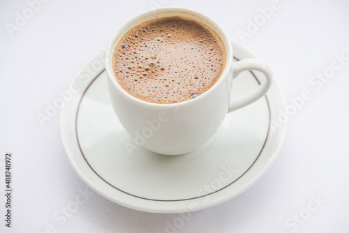 close-up of coffee cup full of coffee and white background. hot fresh turkish coffee