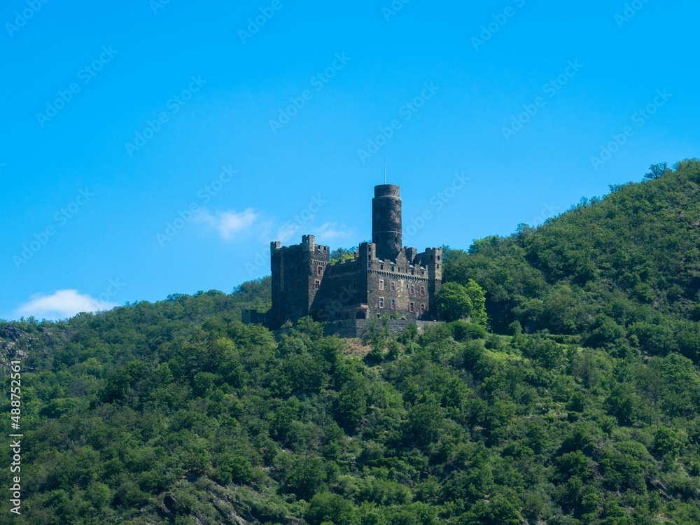 Maus Castle between forests on a hill in the Middle Rhine Valley near Sankt Goarshausen in Rhineland-Palatinate, Germany