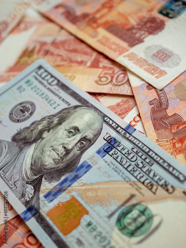 US Dollar and Russian ruble. Money background. Currency exhange. Economic crisis. Rouble dollar cash. Hundred dollar bill and 5000 rubles. Business and finance. Russia and USA