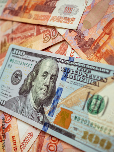 US Dollar and Russian ruble. Money background. Currency exhange. Economic crisis. Rouble dollar cash. Hundred dollar bill and 5000 rubles. Business and finance. Russia and USA