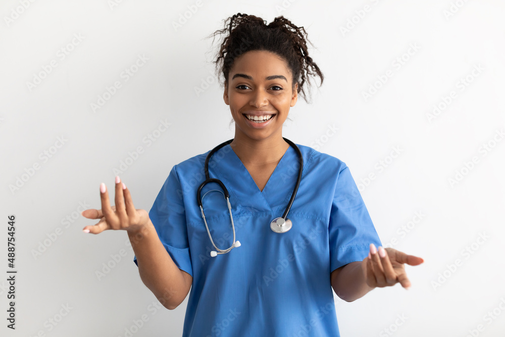 Portrait of black doctor smiling and talking to camera