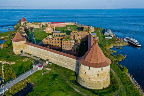 Aerial photography of the Oreshek Fortress in Shlisselburg in summer in Lake Ladoga. Top view of Walnut Island with a fortress. Russia, Shlisselburg, 08.21.2021