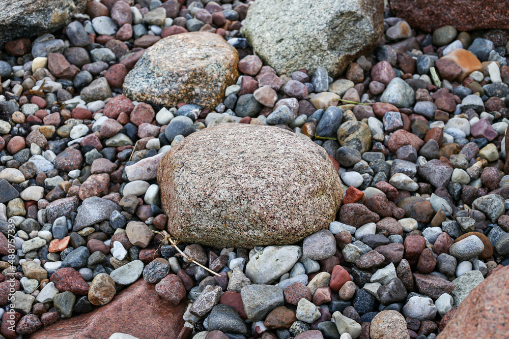 Close up photography view with small and large rocks on a beach. Close up photography view with small and large rocks on a beach.
