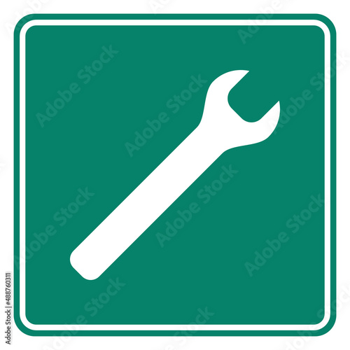 Schraubenschlüssel und Schild